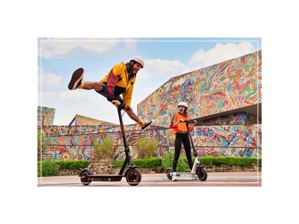 a couple are riding a yadea ks5 pro kickscooter